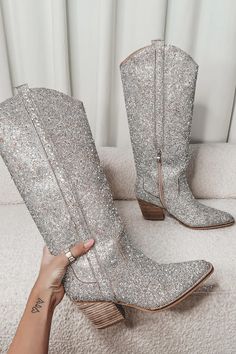 Similar to our BESTSELLING Put The Sparkle In The Party Western Boots, we give you..Shoes That Shine Silver Rhinestone Western Boots!!! Same sparkle, but a little bit taller!! Yes, count us in!!  Silver rhinestone pointed toe western boot, half zipper closure on the inside, heel is a wooden stacked heel  Runs true to s Girl Boss Book, Western Style Boots, Amazing Lace, Western Boot, Womens Mid Calf Boots, Silver Shoes, Western Cowboy Boots, Silver Rhinestone, Mid Calf Boots