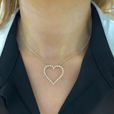 Our Posie Charlie Floating Diamond Heart Necklace is the smallest of the Charlie Cloud Family and has a delicate and charming look! A heart setting houses round brilliant cut diamonds that dance along the neck to create a beautiful but subtle silhouette. This exquisite and elegant design is able to shine alone or can be perfectly layered with another dainty necklace. You’ll love to pair this with a band from the Charlie Cloud family! This necklace is handcrafted by our talented jewelers in our D Heart-shaped Cubic Zirconia Necklace With Prong Setting, Cubic Zirconia Heart Necklace With Diamond Cut, Dainty Diamond Necklace For Valentine's Day, Round Diamond Cut Cubic Zirconia Heart Necklace, Valentine's Day Heart-shaped Brilliant Cut Diamond Necklace, Valentine's Day Dainty Diamond Necklace, Heart-shaped 14k Gold Diamond Necklace With Accents, Diamond Heart Necklace With Prong Setting, 14k Gold Heart Diamond Necklace With Diamond Accents