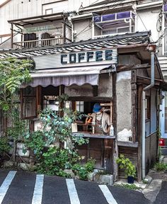 an old coffee shop on the corner of a street