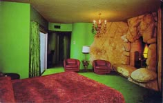 a bedroom with green walls and red bedspread on the bed is decorated in an unusual style