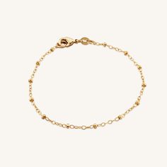 Brighten up your everyday stack with this delicate, gold-filled bracelet. Built to last, this tarnish-resistant bracelet won't lose its gold over time, guaranteeing your look is always polished! • Single Satellite Bracelet• Gold Filled• Chain Length Options: 5"-8"• Bracelet has the option to add a 1" extender to make adjustable Dainty Yellow Gold Beaded Bracelets In 14k Gold Filled, Dainty Everyday Tarnish Resistant Bracelets, Delicate 14k Gold Bracelet, Tarnish Resistant, Dainty Everyday Tarnish-resistant Bracelets, Delicate 14k Gold Tarnish Resistant Bracelet, Delicate 14k Gold Tarnish-resistant Bracelet, Minimalist 14k Gold Chain Bracelet With Extender, 14k Gold Filled Rose Gold Jubilee Chain Bracelet, Everyday Gold Plated Satellite Chain Bracelet