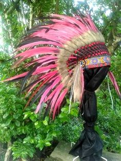 This Indian headdress replica is entirely handmade and truly adorable. Ties in the back for a perfect fit. This will be precious for festivals, photos, a costume, or even room decor. One size fits most ✈️ Worldwide shipping 🐤 I only use authentic feathers ⛺️ I guarantee highest Bohemian Headpieces For Carnival Costume Party, Bohemian Carnival Headband, Bohemian Headpieces For Carnival Festival, Traditional Carnival Costume Headpieces, Bohemian Headband For Costume Occasions, Bohemian Headband For Costume, Handmade Red Festival Headpieces, Handmade Red Headpieces For Festivals, Bohemian Headpieces For Carnival And Festivals