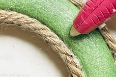 a close up of a banana with a red object on it's end and rope