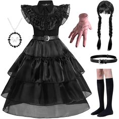 PRICES MAY VARY. 👗🎁 WYB Black Wednesday Addams Costume Dress - A classic character design from the popular TV series, based on the costumes worn by the characters in the movie. This is the best gift for cute girls. 👗🎁 To Make Your Girl A Princess - We match the stylish Wednesday Addams dress with 1*1* necklace, 1* wig, 1 prosthetic hand (thing), 1 pair of socks. Highly restore the characters in the play! 👗🎁 High Quality Skin-Friendly Material - This skirt is made of high quality material, Wendy Adams Halloween Costume, Wednesday Halloween Costume, Cartoon Characters Costumes, Black Wednesday, Prosthetic Hand, Wednesday Costume, Halloween Sleepover, Addams Dress, Wednesday Addams Costume