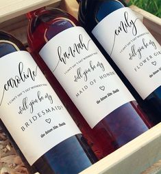 three bottles of wine in a wooden box