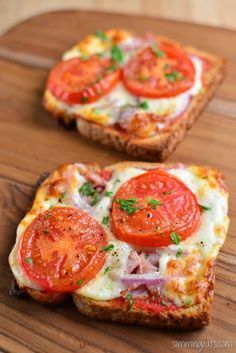 two slices of bread with tomatoes and cheese on them