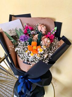 a bouquet of flowers sitting on top of a table