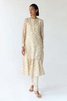 Cloud beige cream kurta with frilled hem, striped, floral hand block prints, fabricated, sequins and thread floral embroidery. Comes with churidar and scarf. - Aza Fashions Cream Straight Kurta For Spring, Festive Off White Kurta For Spring, Unstitched Cream Traditional Wear For Spring, Cream Unstitched Traditional Wear For Spring, Fitted Cream Kurta For Spring, Cream Wedding Kurta For Spring, Cream Spring Traditional Wear, Cream Chanderi Dupatta For Spring, Cream Kurta For Spring Wedding