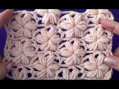 the crochet pattern is made up of two rows of white yarn and has four petals