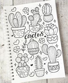 a notebook with cactus drawings on it