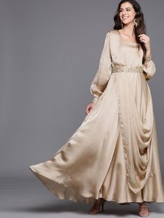 Buy smashing beige solid flared gown with attached dupatta and embroidered belt online at best price. This mind-blowing style kurta goes perfectly for upcoming festive and grand events. Dupatta Attached Gown, Cream Gown With Traditional Drape For Eid, Eid Evening Anarkali Gown, Gold Maxi Length Gown For Eid, Formal Anarkali Gown For Eid, Anarkali Gown For Eid And Formal Occasions, Evening Eid Anarkali Set Maxi Length, Gold Maxi Gown For Eid, Beige Floor-length Gown For Reception