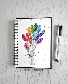 a notebook with some colorful flowers on it