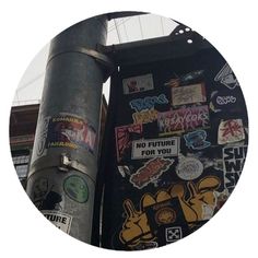 a pole with some stickers on it