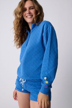 This item is Final Sale. Turn heads in a long-sleeve pullover top with a 1/4 zip high collar cotton-blend top with quilted texture and playful embroidery details, all set on a vibrant cobalt blue fabric. Desert Inspiration, Chic Top, Quarter Zip Sweatshirt, Sleepwear & Loungewear, Pj Sets, Embroidery Details, Rose Print, Zip Sweatshirt, High Collar