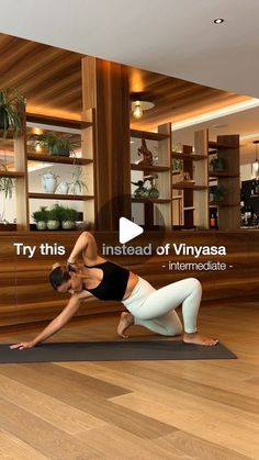 a woman is doing yoga in front of a large screen with the words try this instead of vinyasea