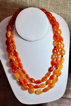 "Beautiful High Quality Natural Chinese Carnelian Multi Strand Polished Bead Necklace (three strands). Between the Beautifully Polished Oval Carnelian Beads are small round Sterling Silver or Faceted Garnet Beads. Simply stunning semi precious stone piece! A Real Show Stopper - Statement Necklace! From the estate of a loved one who had this custom made back in the 1950's. Professional appraisal for this necklace is more than twice the asking price. I am providing this information for the new own Carnelian Oval Beads Necklace For Jewelry Making, Carnelian Gemstone Beaded Necklaces With Oval Beads, Carnelian Oval Beads For Jewelry Making, Carnelian Oval Gemstone Beads, Oval Carnelian Beads For Jewelry Making, Carnelian Gemstone Oval Beads, Oval Carnelian Gemstone Beads, Oval Carnelian Beads, Polished Oval Carnelian Beads