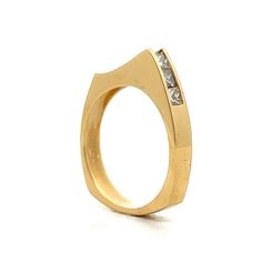 Add a modern twist to your style with this unique stacking ring. This ring features a sleek, asymmetrical design with a row of sparkling princess cut diamonds set in a channel. The diamonds have a total weight of .70 carats and have a VS1 clarity and an H color grade. Crafted in 18 karat yellow gold, the ring offers a vibrant contrast that enhances the diamond's brilliance. The peak-shaped design adds a distinctive touch, making this ring perfect for stacking or wearing alone. Whether you're dressing up for a special occasion or adding some shine to your everyday look, this channel set diamond ring is a stylish and elegant choice. Modern Square Cut Diamond Ring, Modern Emerald Cut Stackable Rings For Formal Occasions, Modern Channel Set Diamond Ring, Modern Princess Cut Single Diamond Jewelry, Modern Princess Cut Diamond Ring With Accents, Modern Diamond Ring For Promise With Square Cut, Modern Channel Set Diamond Promise Ring, Modern Square Cut Diamond Promise Ring, Modern Channel Set Stackable Rings