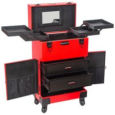 a red tool box sitting on top of a black cart with drawers and shelves in front of it