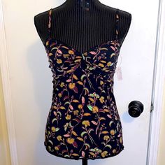 Nwt No Flaws Free People Black Floral Camisole/Tanktop Size Medium Black Sleeveless Tank Top With A Floral Print. Adjustable And Removable Spaghetti Straps. Ruched Cups With Twist Front Detail. Lettuce Hem. Smocked Back. Fitted Style. 95% Polyester, 5% Spandex Approximate Measurements Bust 14" Armpit To Armpit Shoulder To Hem: 21.5" Summer Camisole Tankini With Built-in Bra, Vacation Sleeveless Camisole, Fitted Sleeveless Camisole For Vacation, Fitted Floral Print Tank Top For Vacation, Fitted Floral Print Top With Tank Straps, Summer Stretch Vest Camisole, Fitted Floral Print Cami Tank Top, Fitted Floral Print Camisole With Tank Straps, Fitted Camisole Tank Top For Vacation