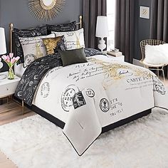 a black and white bed with gold accents