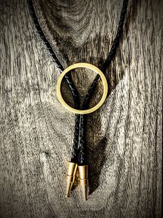 "Brass bolo, round in shape. Custom, one of a kind Bolo tips hand milled in Washington!  PLEASE HELP OUT ARTISTS AND CREATORS Etsy just jacked up all their fees through the roof and I literally can't make this item for any less than it already is. Submit feedback to Etsy about fees and I will gladly drop all of my prices! Each handmade bolo has a unique metal patina giving you a one of a kind piece. The finish is not painted, but actually a chemical reaction/oxidation so the finish becomes part of the base metal. Once the desired look is achieved, I neutralize and seal the patina so it does not continue to change and oxidize...though on the right metal this can be great!  You can dress this up or wear casual with a t-shirt. Either way people will definitely notice this unique piece. PLEASE Modern Bolo Tie, Western Style Gold Lariat Jewelry, Handmade Western Style Gold Jewelry, Handmade Western Gold Jewelry, Adjustable Circle-shaped Hand Forged Jewelry, Adjustable Circle-shaped Hand-forged Jewelry, Handmade Elegant Bolo Ties As A Gift, Handmade Elegant Bolo Ties For Gift, Adjustable Artisan Yellow Gold Jewelry