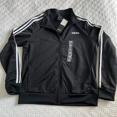 Adidas Black Three Stripe Track Zip Up Jacket. Brand New With Tags Size Women’s Large. Adidas Zip Up Hoodie, Insulated Jacket Women, Adidas Floral, Adidas Zip Up, Adidas Windbreaker, Adidas Track Jacket, Womens Windbreaker, Adidas Jackets, Adidas Running