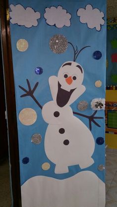 a door decorated to look like a snowman with sparkles on his ears and nose