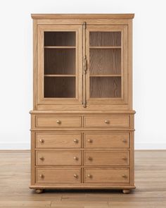 a wooden cabinet with glass doors and drawers on it's front side, against a white background