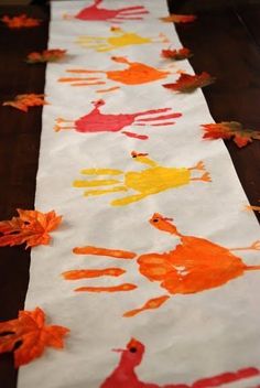 an orange and yellow handprinted table runner