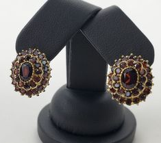 Celebrating 34 years in business and 23 years on eBay!! Our Store | Our Feedback | Contact Us                                     18k Yellow Gold 5.00ctw Garnet Oval Double Halo Leverback Earrings 3/4'' Brought to you by Pawn and Jewelry is this pre owned earrings. This auction is for the earrings only. They weigh 10.7grams or 6.9dwt, there are approximately 5.00ctw of garnets, and are about 3/4 inches long x 5/8 inches wide or 20.3mm long x 16.13mm wide. . Brand: Unknown Type: Earrings Style: L Luxury Oval Cluster Earrings For Formal Occasions, Classic Oval Cluster Earrings For Formal Occasions, Formal Oval Clip-on Earrings, Classic Oval Cluster Earrings For Gifts, Elegant Oval Gemstone Cluster Earrings, Oval Gemstone Cluster Earrings For Anniversary, Formal Oval Pendant Gemstone Earrings, Oval Gemstone Earrings For Formal Occasions, Oval Clip-on Earrings For Anniversary