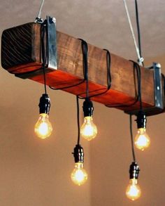 a wooden beam chandelier with light bulbs hanging from it's sides and the words rustic beam chandelier above it