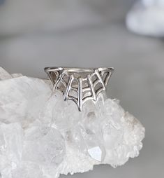 A classic but yet unique spider web ring. Wear by itself or stack with your other favorites. The Measurements: - Height from top to bottom of web ring is approximately .5 inches - Length from widest points of web ring is approximately .75 inches - Band width 3mm The Details: - .925 sterling silver - Handmade in Los Angeles All jewelry can be made in 14k yellow, white or rose gold upon request. Please email us at info@drowningbear.com for a quote. Spider Web Wedding Band, Gothic Sterling Silver Wedding Rings, Internally Threaded Silver Rings For Wedding, Internally Threaded Sterling Silver Wedding Rings, Goth Engagement Rings, Wedding Ring Upgrade, Ring Upgrade, Gothic Ring, Layered Rings