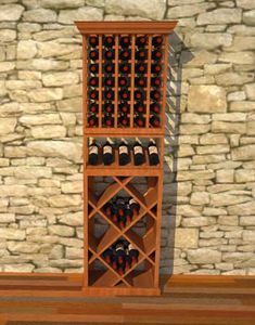 a wooden wine rack filled with lots of bottles next to a stone wall and wood floor