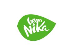 the words yoga nika written in white letters on a green leaf shaped sticker