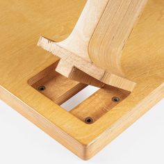 a close up of a wooden object on a white background