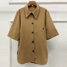 This is perfect for those who are looking for a clothing for a good price. It is fashionable, stylish, and it will look great on anyone who wears it. Do you wanahavit? SIZE S:Shoulder:43cm,Bust:100cm,Sleeve Length:35cm,Length:76cm M:Shoulder:44cm,Bust:104cm,Sleeve Length:36cm,Length:77cm L:Shoulder:45cm,Bust:108cm,Sleeve Length:37cm,Length:78cm Note: 1 inch = 2.54 cm, 1 cm = 0.39 inch note: measurement by hands allow 2-4cm errors which is normal Short Sleeve Office Shirt For Fall, Casual Half Sleeve Office Tops, Fall Blouse With Lapel Collar For Day Out, Solid Button-up Tops For Workwear, Cotton Solid Color Blouse For Work, Solid Color Cotton Blouse For Work, Solid Color Half Sleeve Office Top, Fall Office Shirt With Short Sleeves, Office Half-sleeve Solid Color Tops