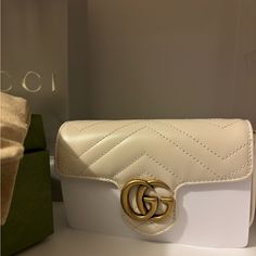 Only Selling Because I Can’t Return It To The Boutique Since It Is Past The Return Period. Otherwise Brand New In Box. The Chain Is Still In The Paper Wrapping Waiting To Be Taken Out. Designer White Bags As Gifts, Designer White Bags For Gifts, White Gucci Bag For Formal Occasions, Classic White Bags With Gold-tone Logo Plaque, Chic White Bag With Gold-tone Logo Plaque, White Bags With Gold-tone Hardware As A Gift, White Designer Gucci Bags, Luxury Cream Gucci Bag, White Gucci Bag For Everyday Luxury