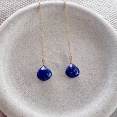 Our dainty lapis lazuli thread earrings are the perfect lightweight everyday earring. As simple as they are, the dangling sparkling semi precious lapis gemstone really makes a statement. We offer a choice of every month's birthstone as well as other popular gemstones in the drop-down menu. We also offer these earrings in gold filled, sterling silver, rose gold and 14k gold. If you need your order by a certain date, it is very important to send us a message on Etsy directly after you place your order, as well as write it in the 'Notes to Seller' at checkout.  For more information, please refer to our FAQ page. Jewelry is handmade by us in NYC focusing on quality using only the highest quality materials and handpicked genuine gemstones.   ▹ PACKAGING All jewelry is beautifully wrapped in tis Blue Adjustable Long Drop Jewelry, Blue Dangle Jewelry With Adjustable Chain, Blue Nickel-free Linear Earrings For Gift, Blue Teardrop Lapis Lazuli Earrings, Blue Lapis Lazuli Teardrop Earrings, Blue Linear Earrings With Ear Wire For Gift, Dainty Blue Drop Jewelry, Blue Long Drop Teardrop Earrings For Pierced Ears, Blue Long Drop Teardrop Earrings