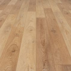 a cat laying on top of a wooden floor