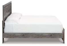 a bed with white sheets and wooden headboard on it's side, against a white background