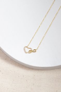 Love can be found even in the smallest details. This infinity heart necklace may seem like a small detail, but it definitely carries the biggest meaning. It is the most elegant representative of immortal love. DETAIL * Made to order. * 100% 14K Solid Gold * Gold Color Selection: Yellow Gold, Rose Gold, White Gold * Cubic zirconia * Pendant Lamp Height: 21 mm / 0.82 inch * Pendant Width: 12 mm / 0.47 inch * Length: 14", 16", 18", 20", 22" (I have a little note in the photos that may help you.) * Ready to Ship in 1-3 Business Days * 100% sourced from the USA * Free returns within 14 days from order date A B O U T ∙ U S * All customization is done by hand. Because it's better this way. * 100% Ethically Sourced, USA raw materials * Our beautiful packaging was created with love and fun on a mot Elegant Heart Necklace With Adjustable Chain For Anniversary, Anniversary Infinity Necklace With Delicate Chain, Dainty Infinity Necklace With Delicate Chain, Infinity Cable Chain Jewelry Gift, Elegant Jewelry With Delicate Chain For Anniversary, Elegant Delicate Chain Jewelry For Anniversary Gift, Elegant Delicate Chain Jewelry For Anniversary, Elegant Sterling Silver Heart Necklace With Cable Chain, Elegant Necklace With Adjustable Chain For Anniversary Gift