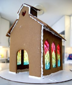 a gingerbread house with stained glass windows