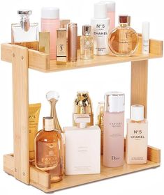 a wooden shelf filled with different types of perfumes