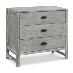 an old gray dresser with three drawers