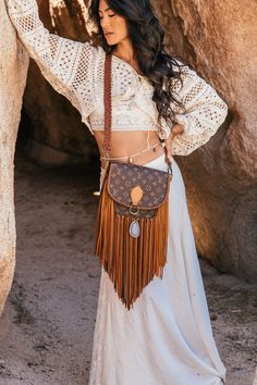 Compact, versatile and cleverly designed with an exterior easy access pocket, the World Traveler is an ideal go-everywhere bag. This messenger-style look is lightweight and roomy yet emanates effortless boho-chic. Dimensions: Medium: Width: 7"x Height: 7" Depth: 2.25"Large: Width: 9.5"x Height: 9.5" Depth: 3"Fringe Length: 12" Strap Options Option 1: Braided Adjustable crossbody strap from 30" to 57"Option 2: Adjustable crossbody & 19" Shorty round braided strap ***charm and beads pictured are i Vintage Designer Bags, Blonde With Pink, Beads Pictures, Boho Fringe, Good Luck To You, Boho Bags, Dirty Blonde, Braided Strap, World Traveler