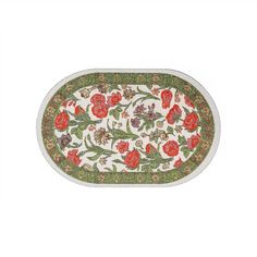 an oval rug with red flowers and green leaves on white background, in the shape of a flower