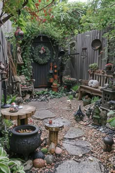 an outdoor garden with lots of plants and potted plants