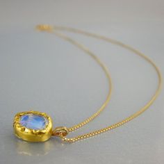 Wedding Jewelry for Brides, Rainbow Moonstone Necklace, Moonstone Pendant, Solid Gold Necklace, Moonstone Bridesmaid Necklace, Mom GiftAn organic yet delicate moonstone necklace featuring a genuine rainbow moonstone, bezel set in 22K solid gold, welded on sterling silver.This moonstone pendant is like an eye to our inner spirit.The chain is 14K solid gold.Wear this delicate necklace on your special wedding day, or add a touch of elegance to your everyday wear. Measurements:Center stone: 6/8 mmNe Moon Phase Round Pendant Necklace For Wedding, Wedding Necklaces With Moon Phase Round Pendant, Dainty Moon-shaped Wedding Necklace, Delicate Moonstone Necklaces For Wedding, Delicate Moon Charm Necklace For Wedding, Delicate Wedding Necklaces With Moon Charm, Delicate Moonstone Necklace For Wedding, Delicate Wedding Necklace With Moon Charm, Moon Charm Pendant Necklace For Wedding