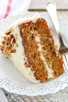 a slice of carrot cake on a white plate