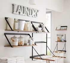 the shelves are filled with various items in the bathroom